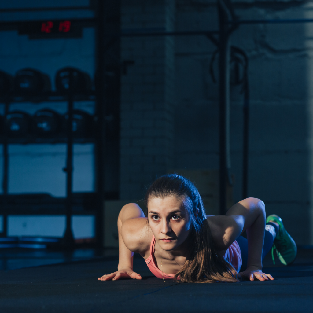 Photo of a women performing a burpee exercise
